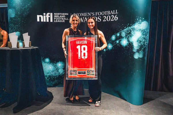 Cliftonville's Charlotte Havern accepts her PFA NI Young Player of the Year award from Oonagh Kelly from Kingsbridge. Pic: NIFL