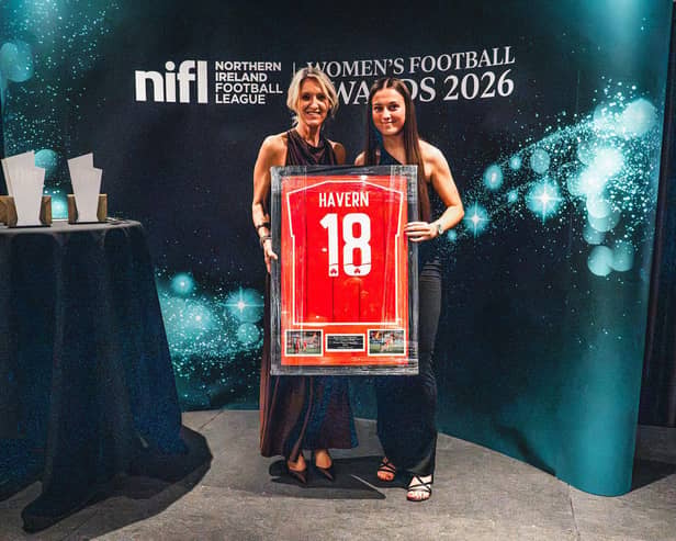 Cliftonville's Charlotte Havern accepts her PFA NI Young Player of the Year award from Oonagh Kelly from Kingsbridge. Pic: NIFL