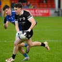 Miceal Rooney races past Scotstown's Darren Hughes at Pairc Esler when the sides met last year in the Ulster quarter-final. Pic: Brendan Monahan