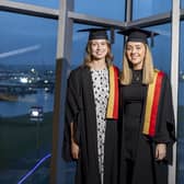 Molly Liggett from Poyntzpass and Aimee Clerkin from Rostrevor at the Accounting Technicians Ireland  graduations at  the Titanic Centre, Belfast. Pic: Fintan Clarke.