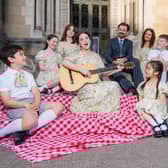 Anna Maria Boyle and Samuel Moore who play Maria and Captain Von Trapp photographed with the Von Trapp Children.