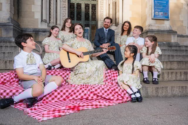 Anna Maria Boyle and Samuel Moore who play Maria and Captain Von Trapp photographed with the Von Trapp Children.