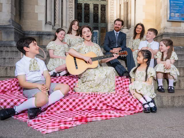 Anna Maria Boyle and Samuel Moore who play Maria and Captain Von Trapp photographed with the Von Trapp Children.