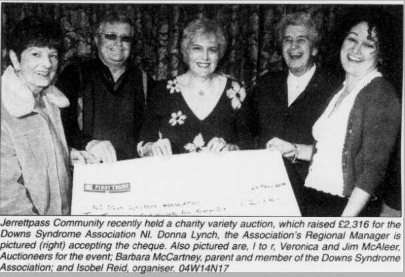 Jerrettspass Community held a charity variety auction in 2004 which raised £2,316 for the Downs Syndrome Association NI. Donna Lynch, the Association's Regional Manager, is pictured (right) accepting the cheque. Also pictured are (L-R) Veronica and Jim McAleer, Auctioneers for the event, Barbara McCartney, parent and member of the Downs Syndrome Association; and Isobel Reid, organiser.