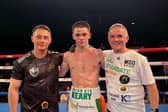 Donagh Keary after his emphatic win in MSG flanked by coach Ryan Burnett and Co Manager Bobby Lavery.