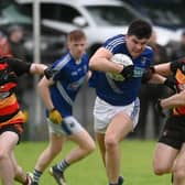 Ryan Garvey powers his way past Cullyhanna's Mickey Murray.