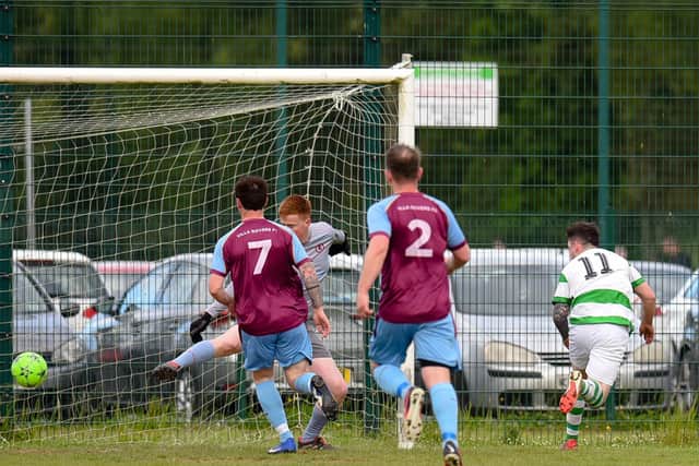 Newry Celtic striker Caolan Gray beats Villa keeper Conor McAteer to score his second goal at Derrylecka. Pictures: Brendan Monaghan