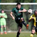 Bridge midfielder Thomas Hardy lift's the ball over Church Street defender Davy Bagnall on Saturday Pictures: Brendan Monaghan