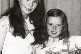 Rosemary O’Hagan, daughter of Mr P O’Hagan, Clerk of Newry No. 1 Rural District Council, presenting a bouquet of flowers to Dana at a reception marking the naming of “Dana Place,” Hilltown. Courtesy of The Outlook