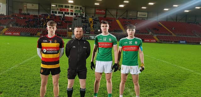 The captains of Abbey CBS and St Patrick's pictured with the referee ahead of their MacRory Cup clash at Pairc Esler on Wednesday evening. Credit: Ulster Schools GAA