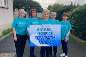 ​Deborah Kennedy (centre) celebrates the 35th Towpath Walk.