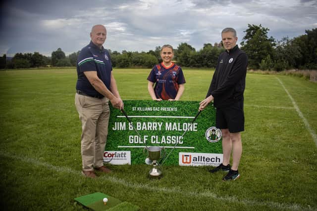 Kieran Shields, Chairman and Brian McKeown with Ruby Murphy.