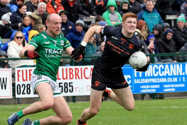 Armagh's Ciaran Mackin looks to move the ball on after going past Fermanagh's Ché Cullen.