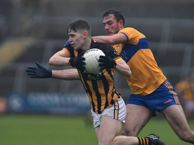 Crossmaglen's Caolan Finnegan under pressure from Silverbridge's Pete Carragher