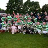 Newry Celtic players, Management and young supporters celebrate winning the Fr Davies cup final after a 2-1 win over Camlough Rovers at Jennings Park Picture: Brendan Monaghan BM01