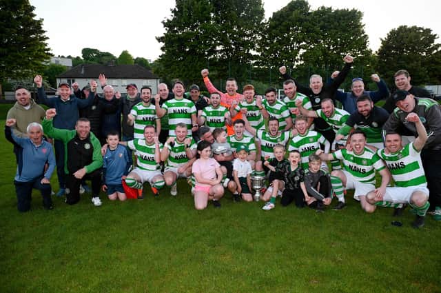 Newry Celtic players, Management and young supporters celebrate winning the Fr Davies cup final after a 2-1 win over Camlough Rovers at Jennings Park Picture: Brendan Monaghan BM01