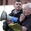Supporters of an independent public inquiry into the murder of solicitor Pat Finucane hold a protest outside the High Court in Belfast in 2009.  Mark Thompson (left) from Relatives for Justice and Monsignor Raymond Murray pictured speaking at the protest.  Pat Finucane was murdered 20 years ago this month.