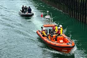 The vessel being towed into Kilkeel harbour.