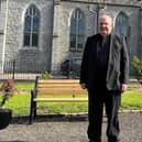 Canon Francis Brown in the grounds of Newry Cathedral.