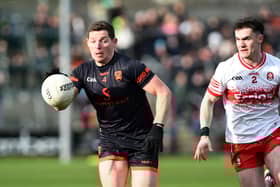 Armagh's Paddy Burns sprints past Derry's Diarmuid Baker during their league meeting in March.