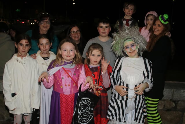 The McNally and Carr families wait for the Halloween fireworks to start. INNR4431