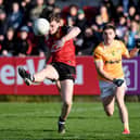 Down fullback Ryan McEvoy fires over the opening point against Antrim at Pairc Esler