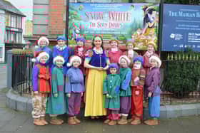 Snow White (Judith Quinn) and the two teams of seven dwarfs.
