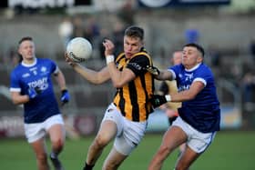 Crossmaglen's Oisin O'Neill drives past Clan's Michael McConville