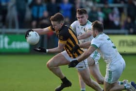 Crossmaglen's Stephen Morris under pressure from Granemore's Kieran Doyle and Ross Finn