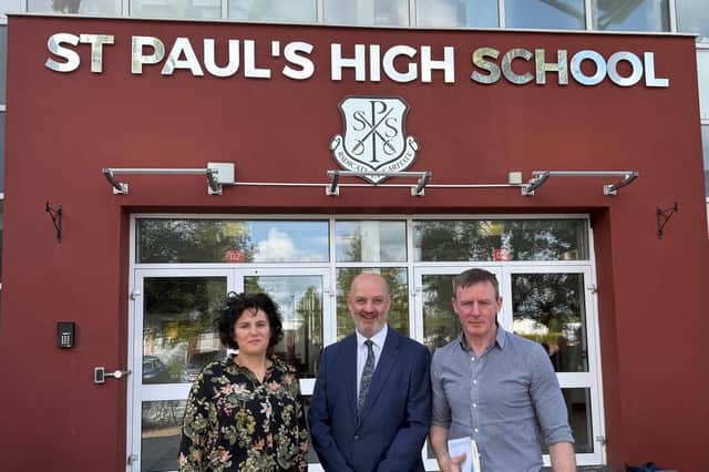 Justin McNulty MLA and SDLP leader, Claire Hanna MP, with St Paul's High School principal, Dáithí Murray.