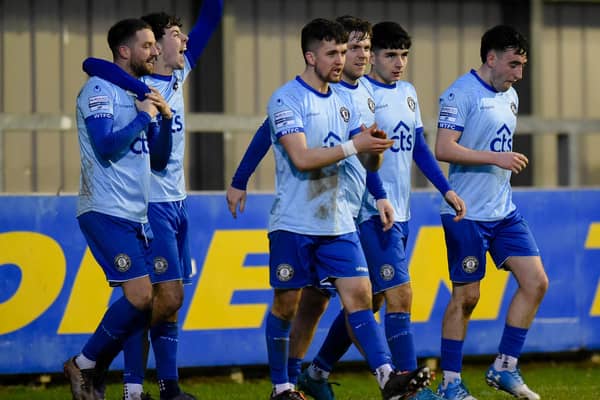 Warrenpoint players celebrate Saturday's winning goal scored by Rory Powell (second from right) against Rathfriland Rangers. BM02