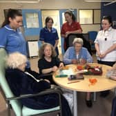 Staff Nurse Dara Greer, Deputy Sister Moya Maguire with Ward Manager Sr Ursula Haughey, Student Nurse Ella McQuillan and Senior Nursing Assistant Margurite Murphy with patients Jean and Agnes who are enjoying their programme with Artist in Residence Caroline Shimmons on the Stroke and Rehab Ward in Daisy Hill Hospital.