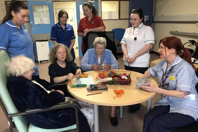 Staff Nurse Dara Greer, Deputy Sister Moya Maguire with Ward Manager Sr Ursula Haughey, Student Nurse Ella McQuillan and Senior Nursing Assistant Margurite Murphy with patients Jean and Agnes who are enjoying their programme with Artist in Residence Caroline Shimmons on the Stroke and Rehab Ward in Daisy Hill Hospital.