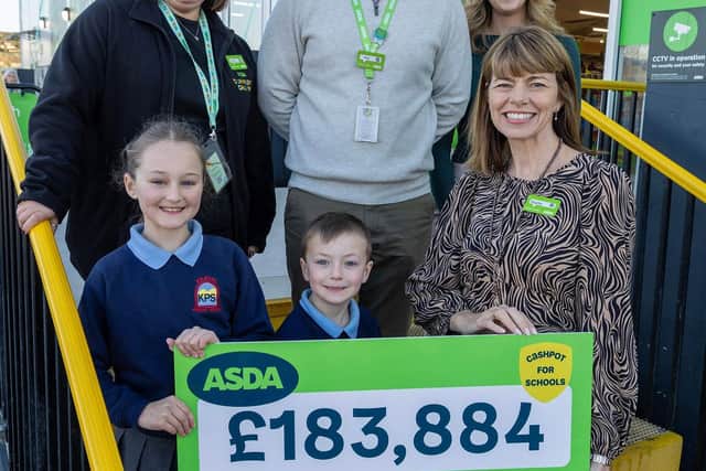 Back (L-R) Lisa Cunningham, Asda Kilkeel Community Champion, Niall Keyes, Senior Director Asda NI, Melanie McMath, Teacher, Kilkeel Primary School  Front (L-R) Rosie (7) & Joey (5) Kilkeel Primary School & Hayley Tatum MBE, Chief People and Corporate Affairs Officer at Asda