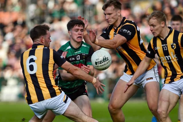 Killeavy's Fergal Boylan is put under pressure by Crossmaglen trio Callum Cumiskey, Rian O'Neill and Cian McConville.