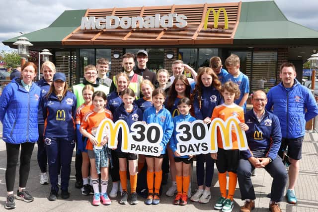 Kakib Kozuba, Shea Magee, Conor Greer, Ethan Mulholland, Kate Gamble and Sean Fusco from McDonald's Newry alongside members from Damolly Youth FC.