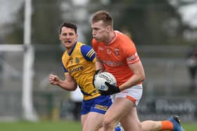 Armagh's Rian O Neill drives forward with Roscommon's Diarmuid Murtagh in tow