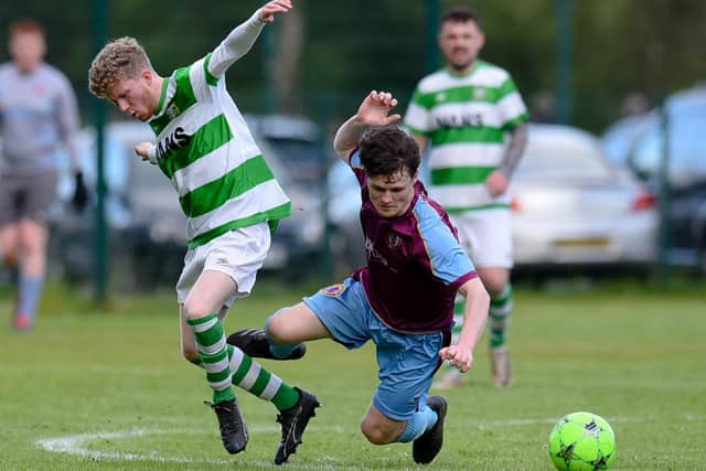 Celtic defender Aaron Downey tangles with Villa Rovers attacker Eoin Devlin in the Fr Davies cup semi-final at Derrylecka.